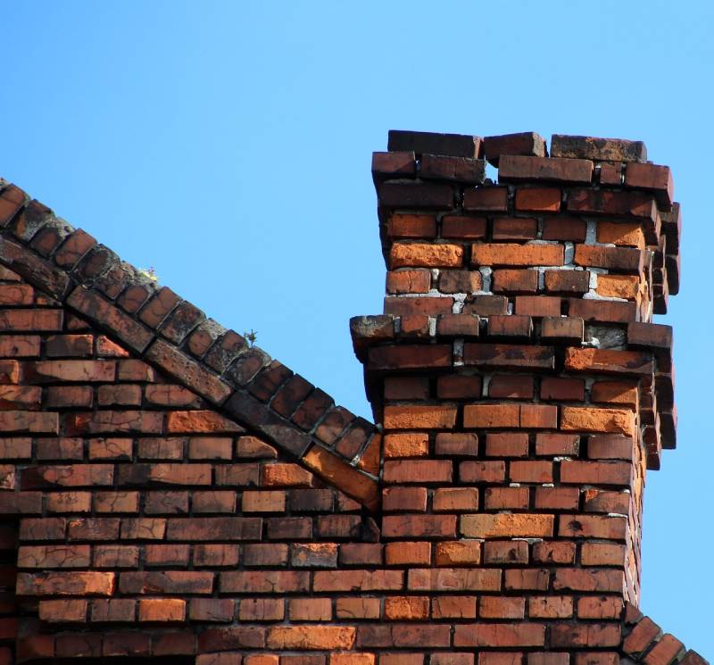 Signs Your Wellington Home Needs a Chimney Inspection Damaged chimney on an Wellington home showing cracks and missing mortar
